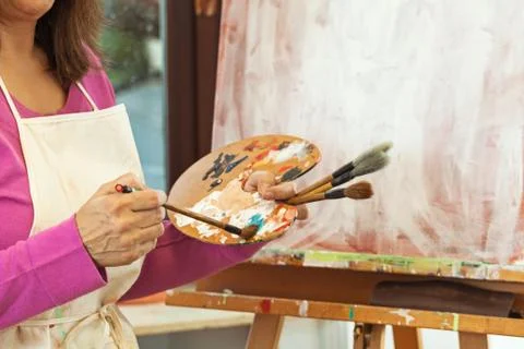 Painter working in studio Stock Photos