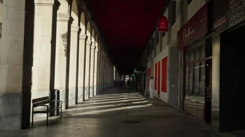 Painter working under the arcades of Gijon Stock Footage 346920623