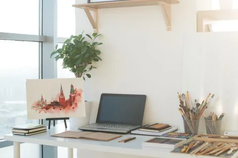 Painter workplace in order side view. Designer desk with drawing equipment. Home 스톡 사진