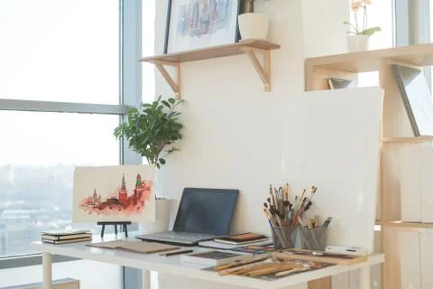 Painter workplace in order side view. Designer desk with drawing equipment. Home Stock Photos