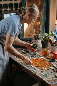 Painter in workspace creating modern art Stock Photos