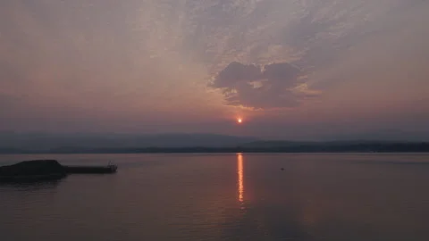 Painterly sunrise over rural lake Stock Footage 136561053