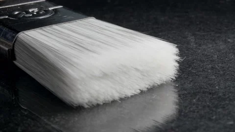 Painter's brush. Construction tool on a dark background. Bristles. Stockbeeldmateriaal 139486477