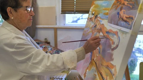 Painter's hand using color palette Stock Footage 124369448