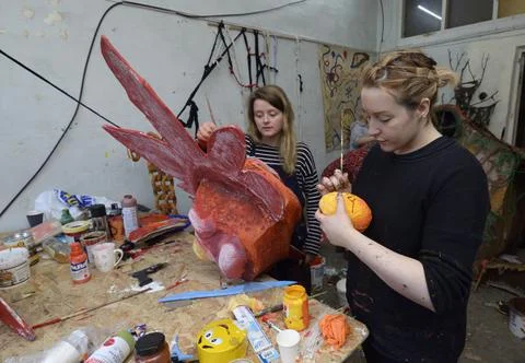 Painters working at their creative workshop. Stock Photos