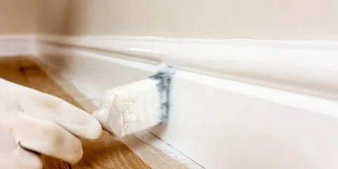 Painting a baseboard Stock Footage