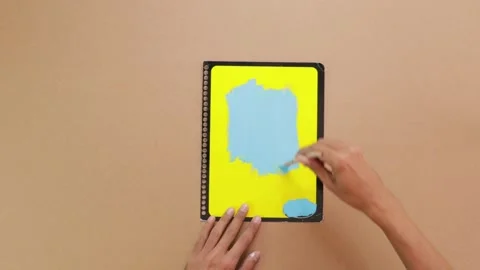 Painting blue notebook cover Stock Footage 285586357