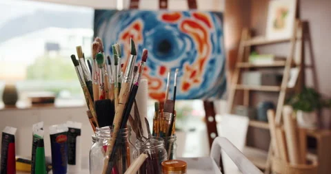 Painting, canvas and brushes in empty studio with abstract design, color pattern Stock Footage 312800771