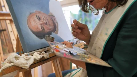 Painting course student making a portrait Stock Footage 124366273