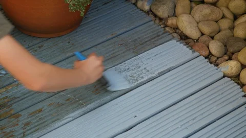 Painting decking with blue paint Stock Footage 115057700