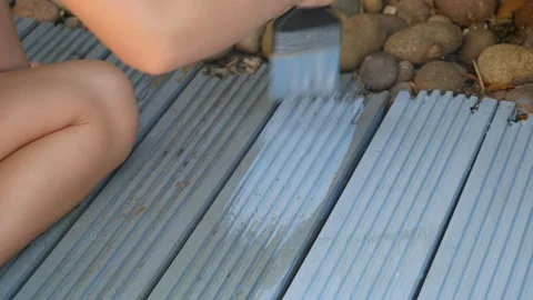 Painting decking with blue paint 動画素材 115057739