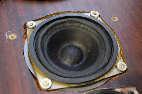 Painting diffusers of speakers with stamp paint to give them aesthetics. Mid- Stock Photos