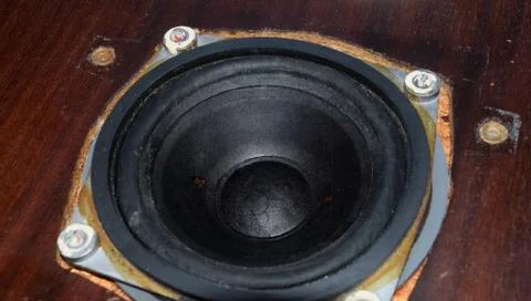 Painting diffusers of speakers with stamp paint to give them aesthetics. Mid- Stock Photos