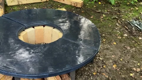 Painting DIY Concrete Fire Pit Table with Black Paint Video stock 342630830