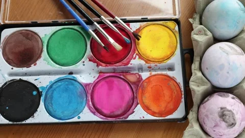 Painting easter egg. Colorful water colors. Brush. Stock Footage 310259793
