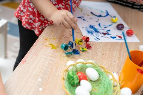 Painting easter eggs at home, preparing for easter holiday traditions Stock Photos