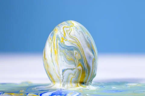 Painting Easter eggs, Preparation for spring holiday, Liquid marble texture, Stock Photos