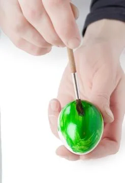Painting an egg Stock Photos
