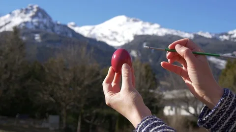 Painting eggs on the background of the mountains Stock Footage 73462168