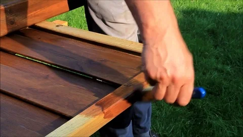Painting fence with glaze Stock Footage