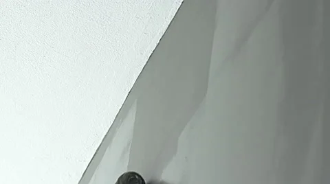 Painting gray wall to ceiling with roller brush extension 4K Stock Footage 49272224