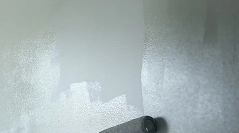 Painting gray wall with roller brush extension 4K Stock Footage 49273071