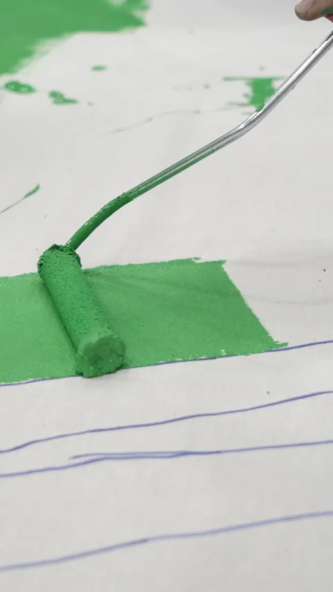 Painting Green with Cylindrical Brush Stock Footage 296602011
