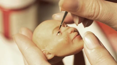 Painting a hand made puppet head by hand 스톡 동영상 89907310