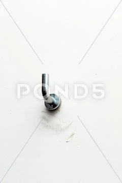 Painting hanger on white wall Stock Photos