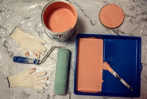Painting instruments for homeworks: brush, rollers, gloves, bucket Stock Photos