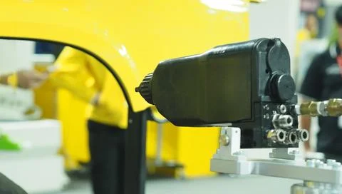Painting machine with robot automatic arm. Stock Photos