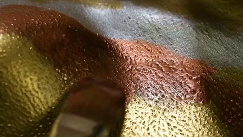 Painting on models body with brush. Macro footage of art bodypainting. Stock Footage 103440353