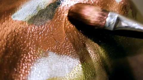 Painting on models body with brush. Macro footage of art bodypainting. Stock Footage 103440366