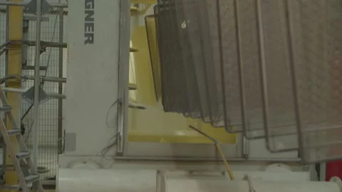 Painting process of wired mesh cages moving on the track in the factory Stock Footage 153468704