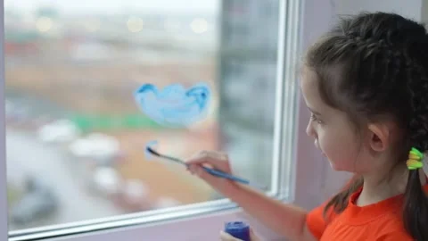 Painting raining cloud on window Stock Footage 295607321