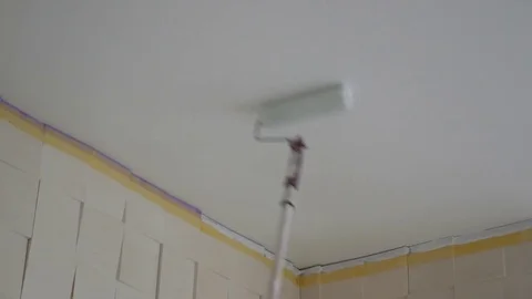 Painting the seiling with paint roller Stock Footage 84885855