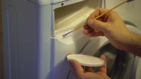 Painting the surface of an old washing machine Stock Footage 152546652