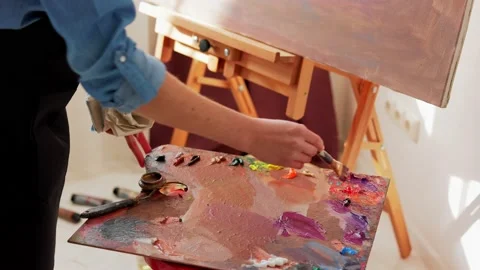 Painting technique and painters concept. Girl artist working in studio. Talented Stock Footage 166364683