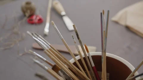 Painting tools on a table in a ceramics workshop Stock Footage 321314142