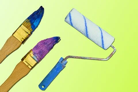 Painting tools used roller and paint brushes on tender green Stock Illustration
