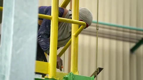 Painting using a roller in industrial areas Stock Footage 265527805