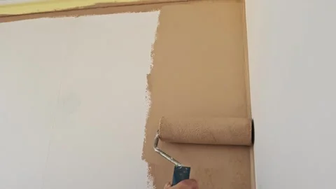 Painting a Wall Beige Stock Footage 293553431