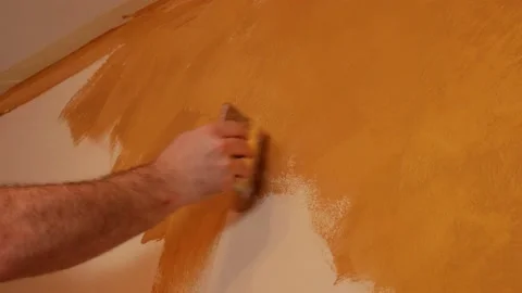 Painting the wall with a brush Video stock 224787428