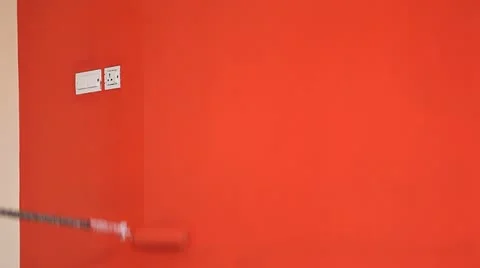 Painting wall Red with roller Stock Footage 10836826