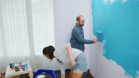 Painting wall with roller brush Video stock 133560264