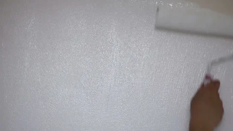 Painting the wall with a roller Stock Footage 114386618