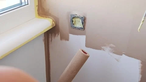 Painting a Wall with a Roller Video stock 290218259
