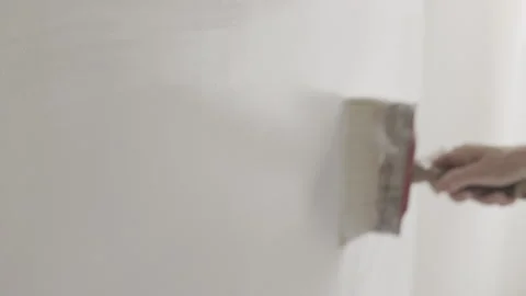 Painting  wall with white paint Stock Footage 345891450