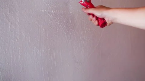 Painting the wall with white paint using the roller. Stock Footage 134783068