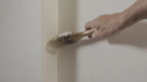 Painting the wall white using brush Stock Footage 345843751